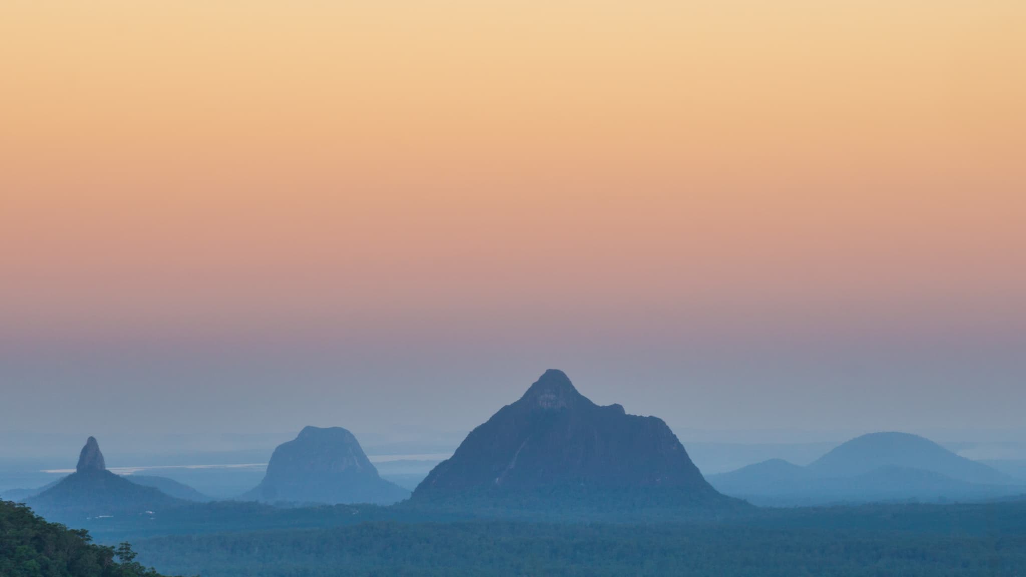 Sunset view of the Glasshouse Mountains, Sunshine Coast, Queensland. Source: Wikipedia